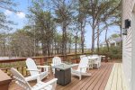 Lovely deck with a propane fire pit and outdoor dining table